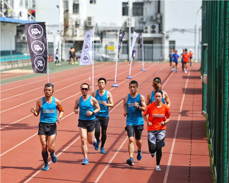 a team runs towards the finish line after a marathon. run, runners. running, marathon, team, teamwork, motivation