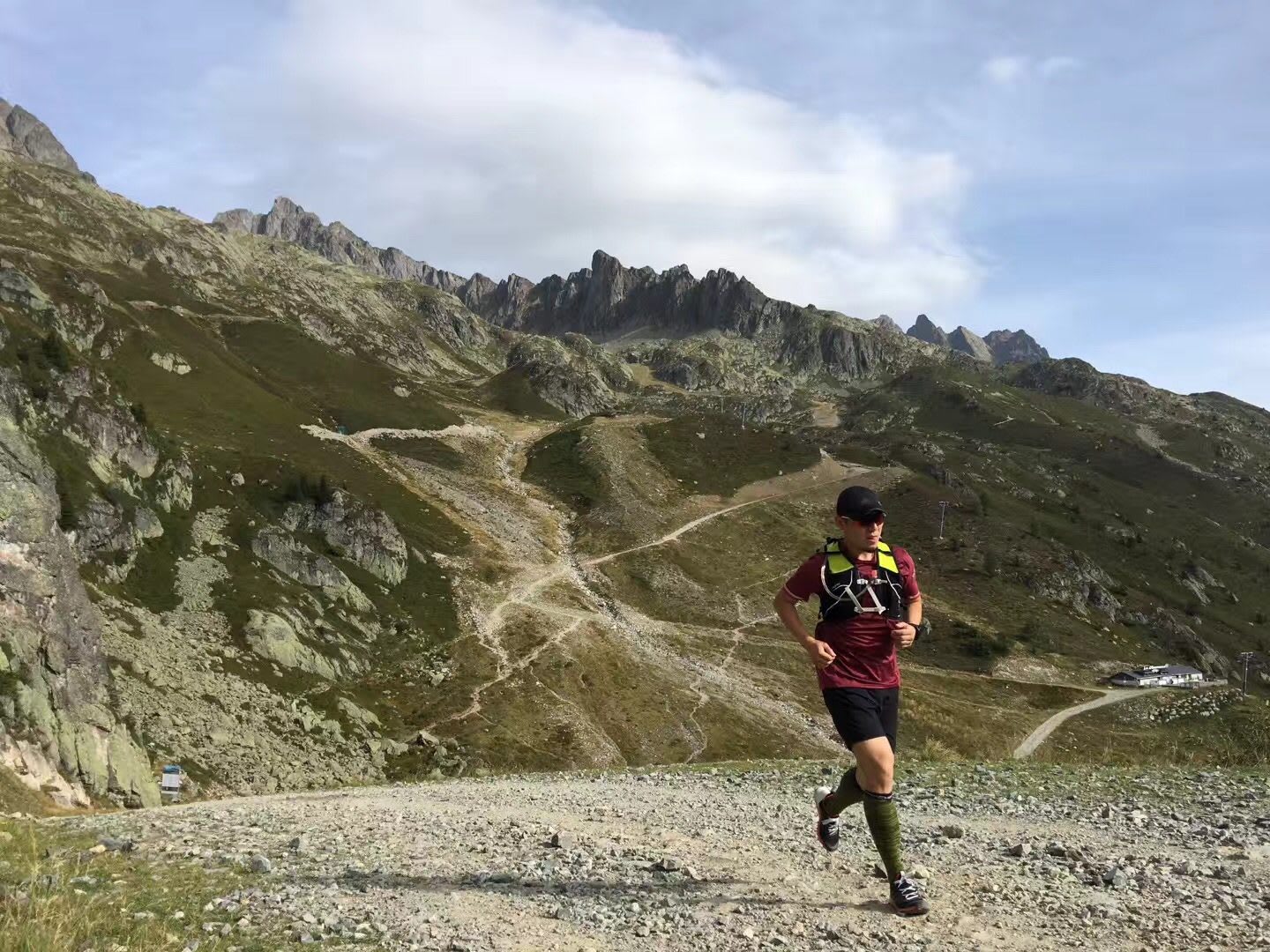 A man runs alone across a rocky terrain on top of a valley. run, running, training, ,motivation,
