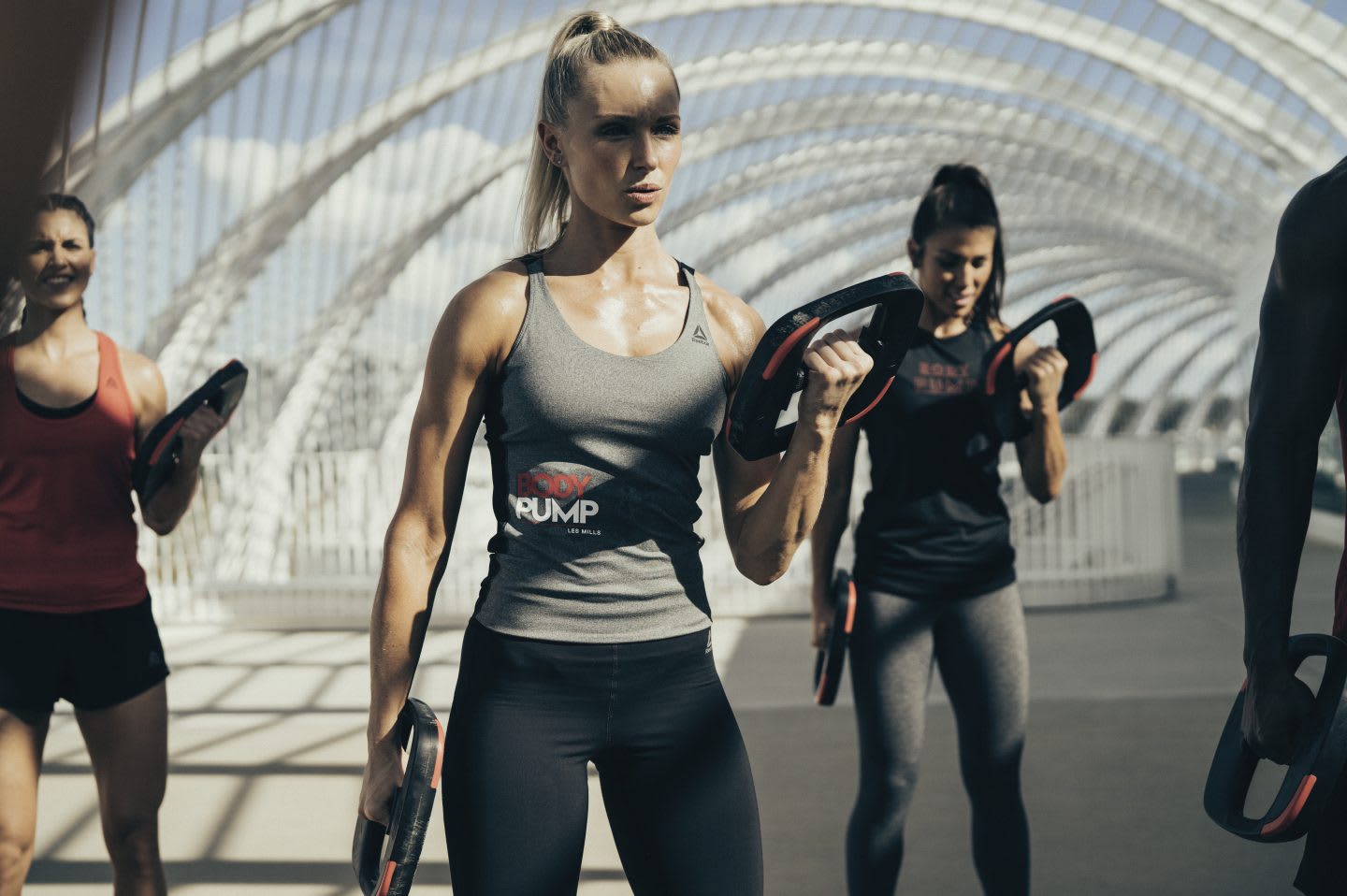 Women lifting weights during a fitness class. workout, weights, health, nutrition, GamePlan A, training, muscles, fat, weight loss