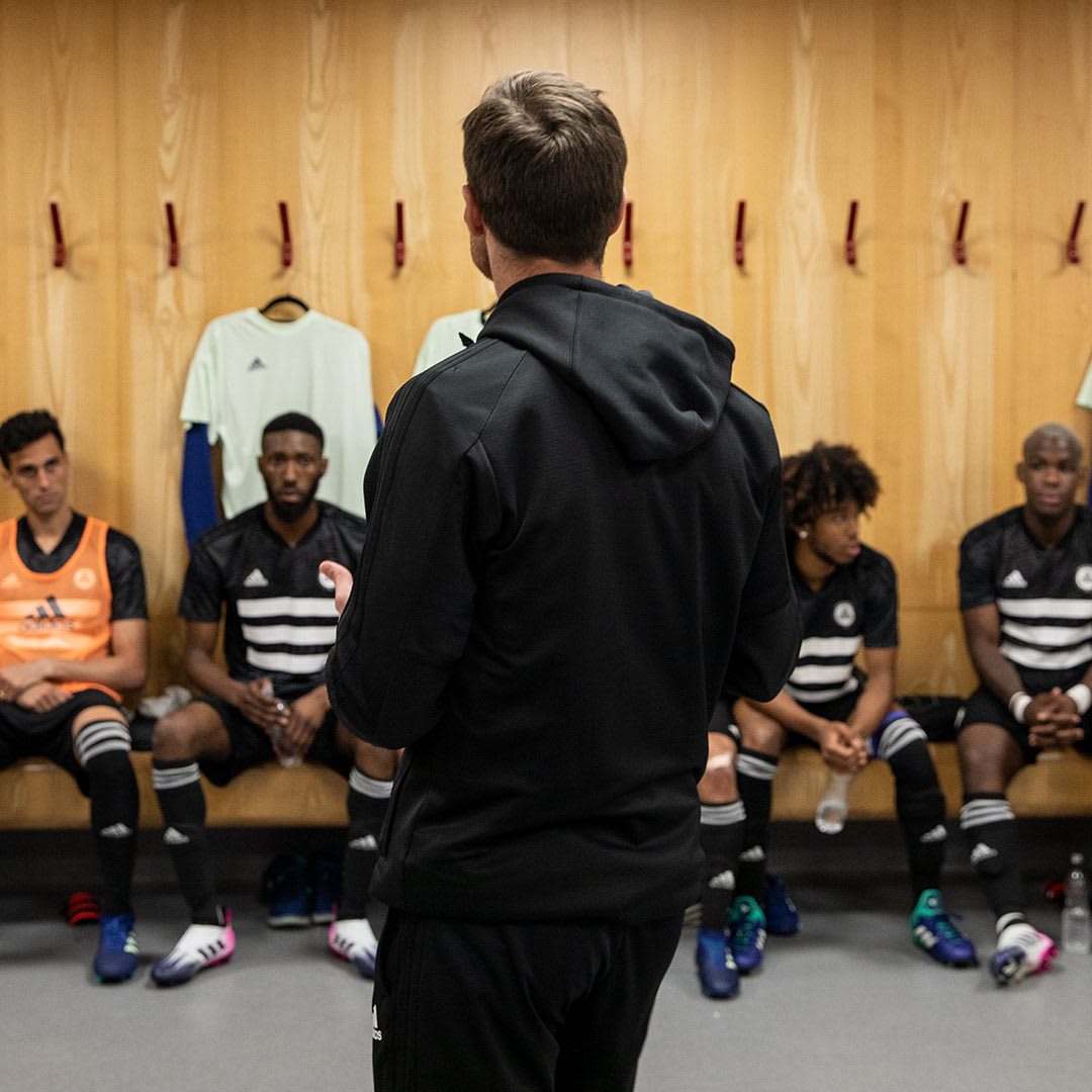 The Tango Squad team sits in anticipation in the locker room before a big match. football, Tango, FC, locker room, team