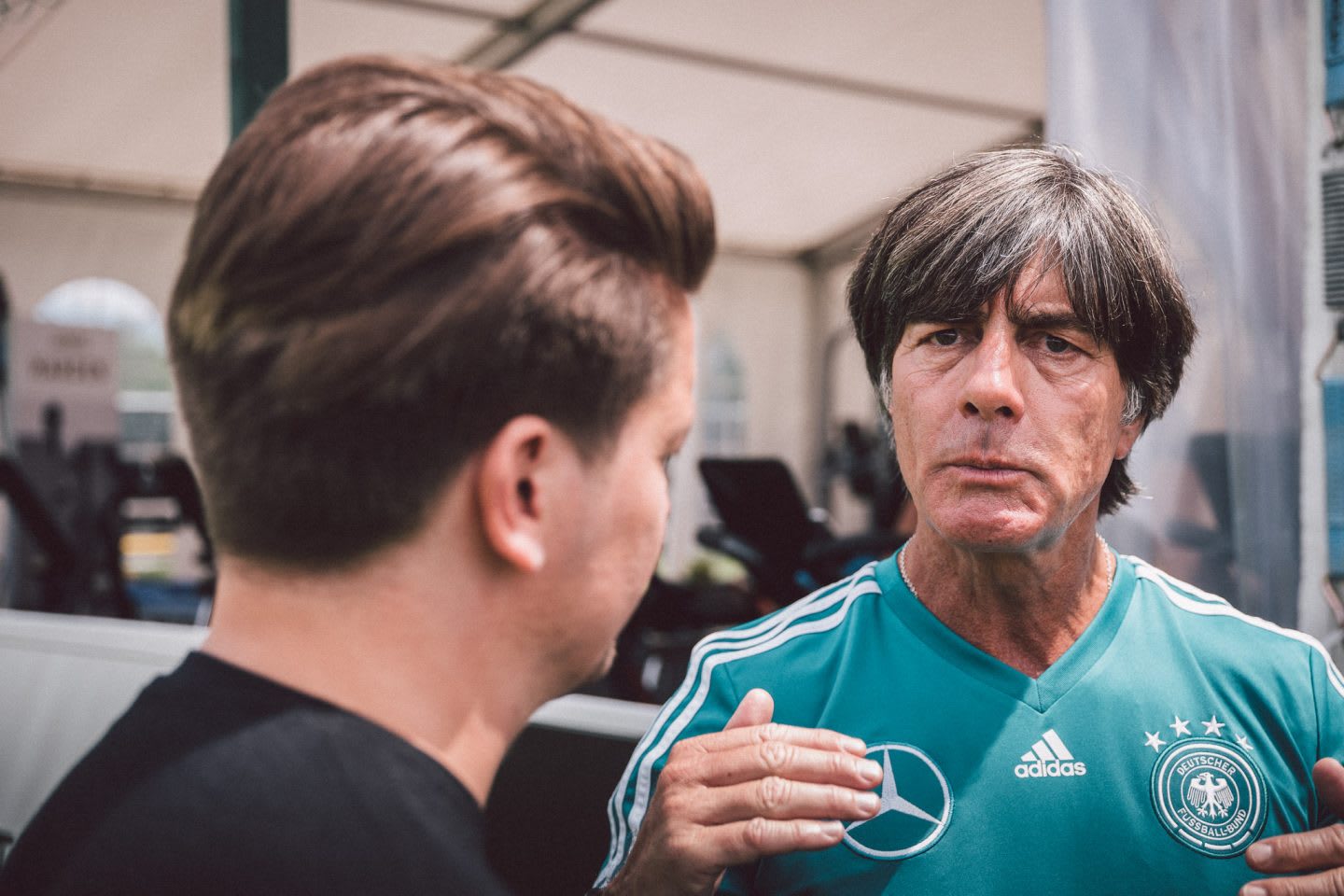 Germany national team coach Joachim Löw talking to a Sports Marketing Manager from adidas. GamePlan A, team, success, 2018 FIFA World Cup Russia, leadership, World Champions