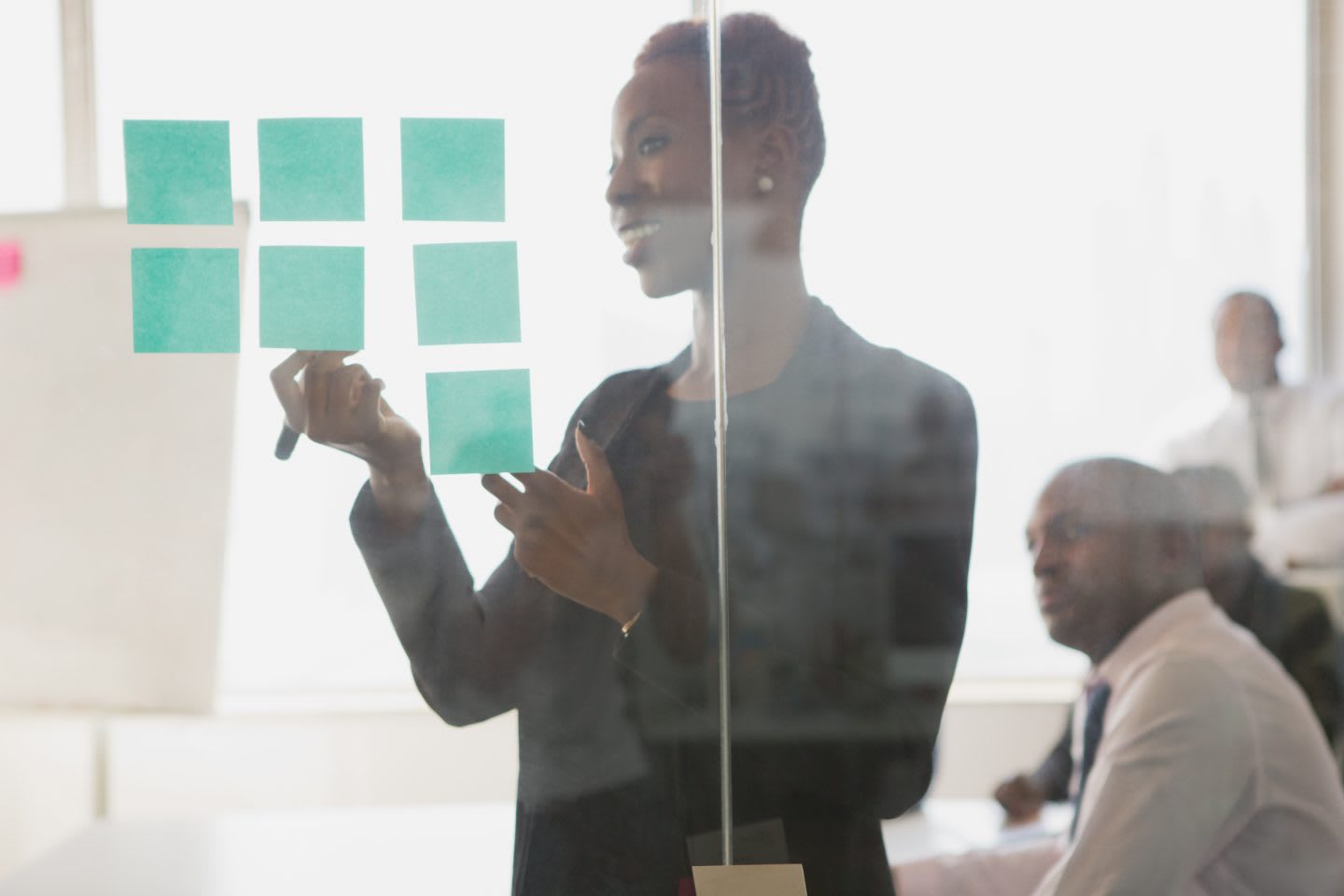Businesswoman leading meeting in conference room