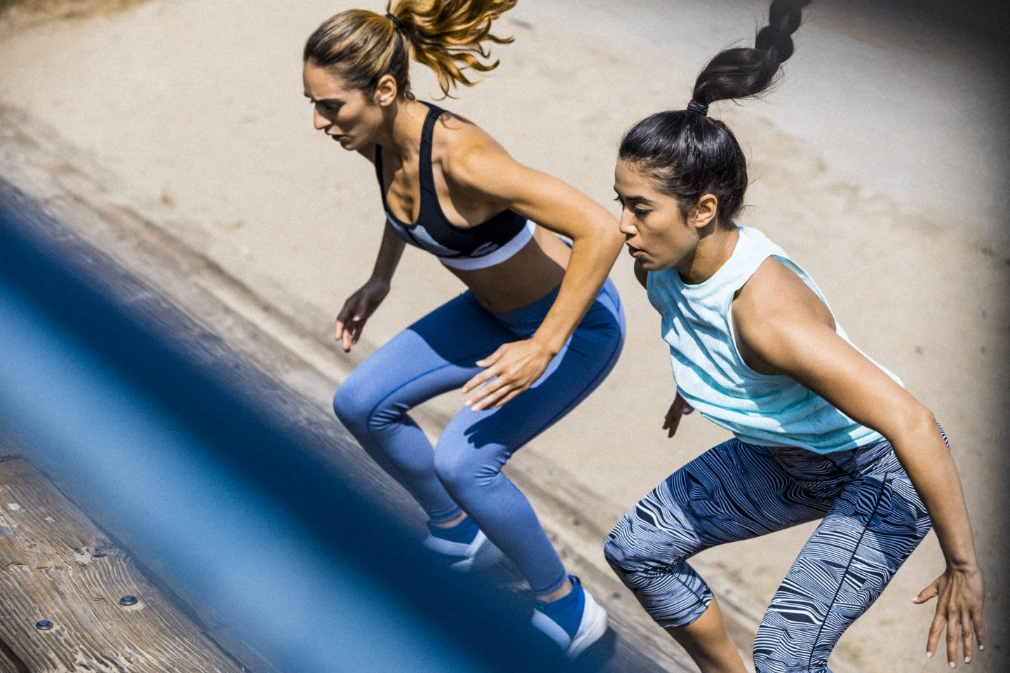 Two women partnering up for a workout.