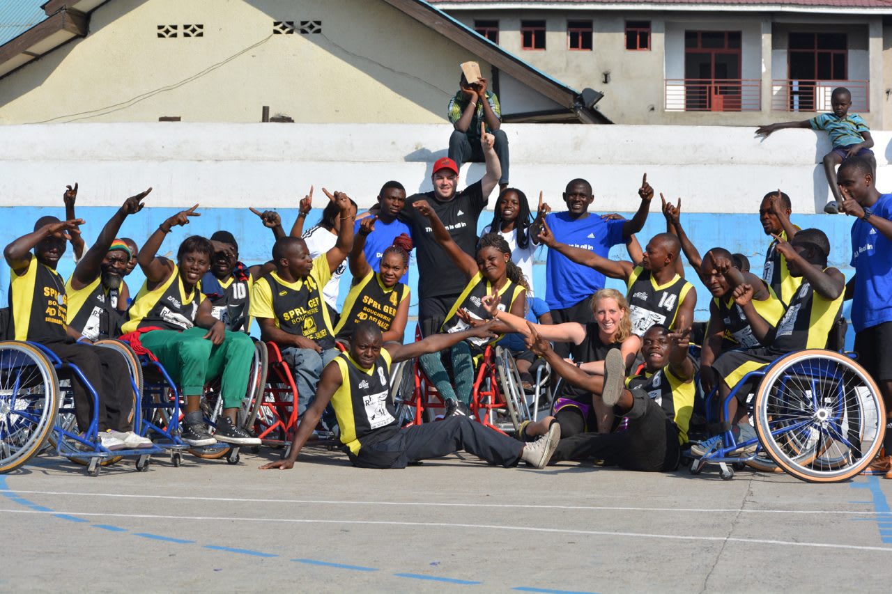 Group picture of an African wheelchair basketball team cheering. A poster in one of our office gyms encouraging colleagues to join our fundraising effort.