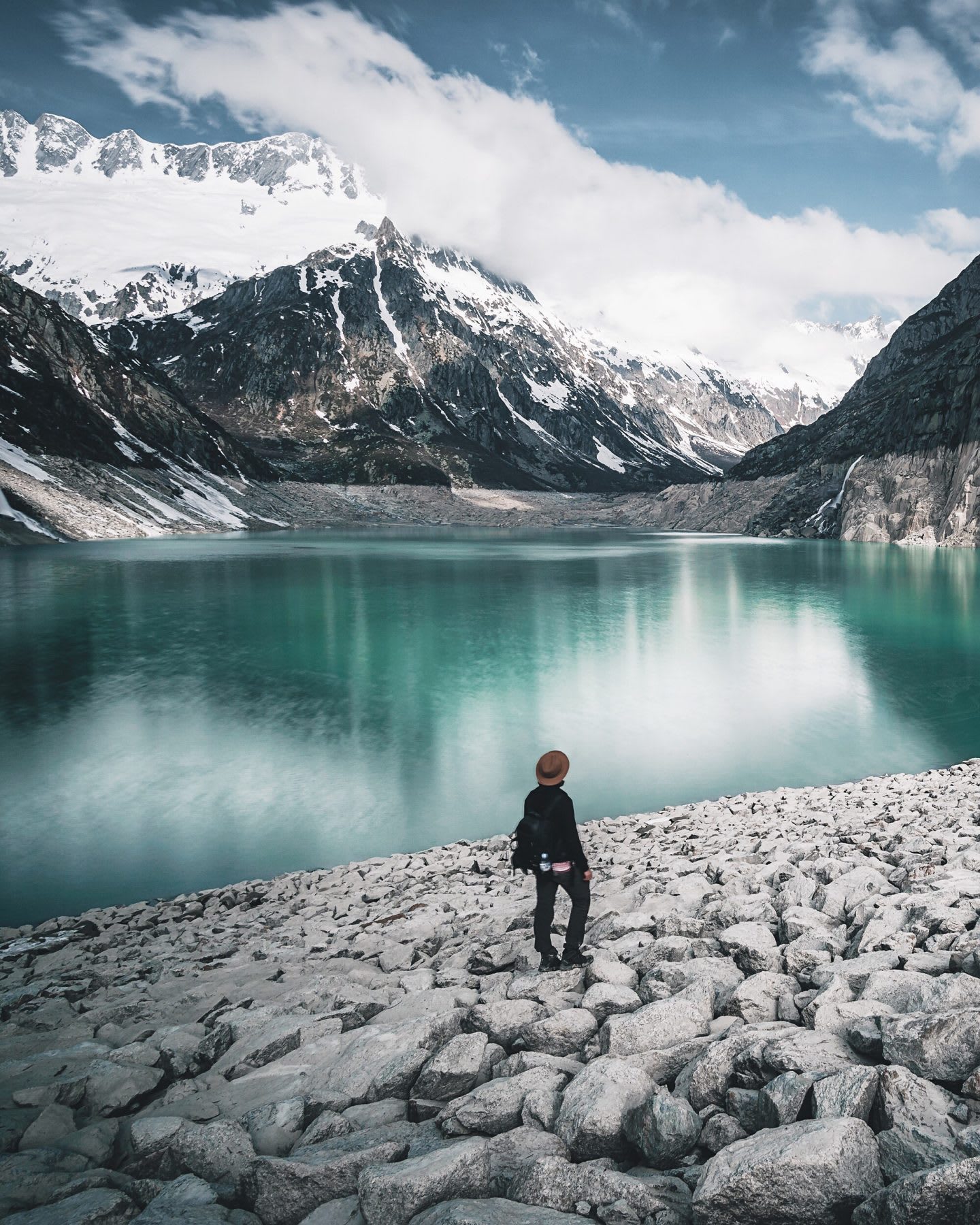 Man Standing On Rock By Lake Against Sky. nutrition tips, healthy nutrition, fitness, outdoor, hiking, food, GamePlan A