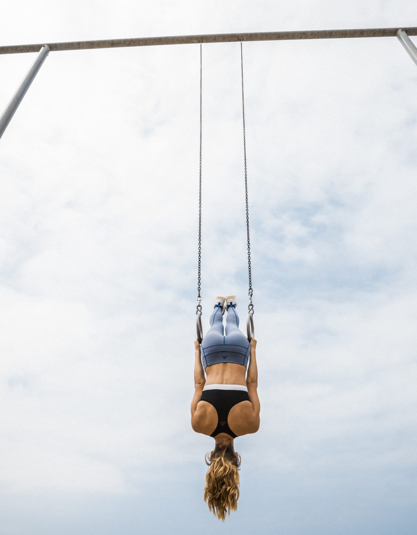 Woman hanging on rings upside down, changing perspectives, work out, motivation, inspiration, performance, gymnastics, adidas, GamePlan A