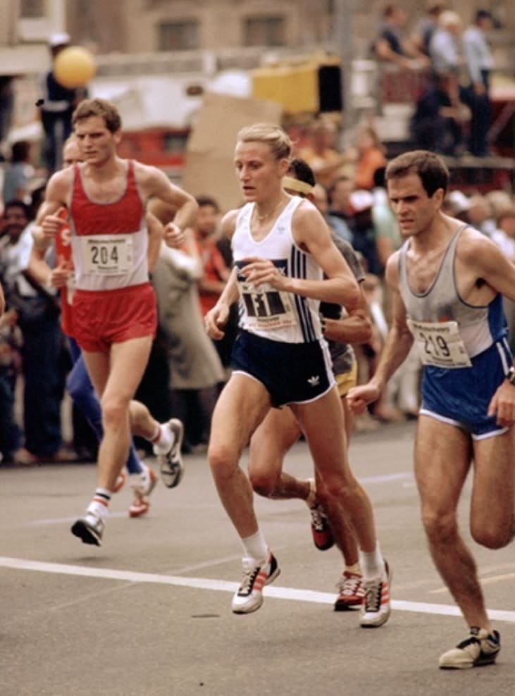 Grete Waitz female marathon athlete running New York Marathon among men on a street, marathon run, female runner, chase a goal, run against cancer, fighting against cancer, New York City Marathon, exercise oncology, physical activity, sports marketing, adidas, GamePlan A