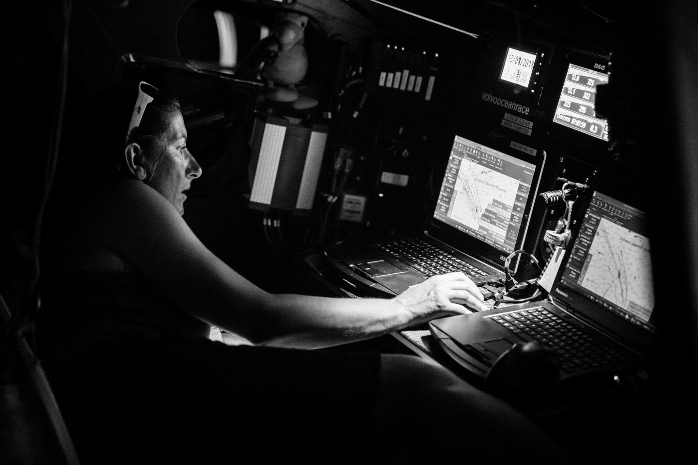 Woman analyzing route on laptop computer, Dee Caffari, sailor, yachtswoman, confidence, leadership, positivity, black and white, Turn the Tide on Plastic, Melbourne. Hong Kong
