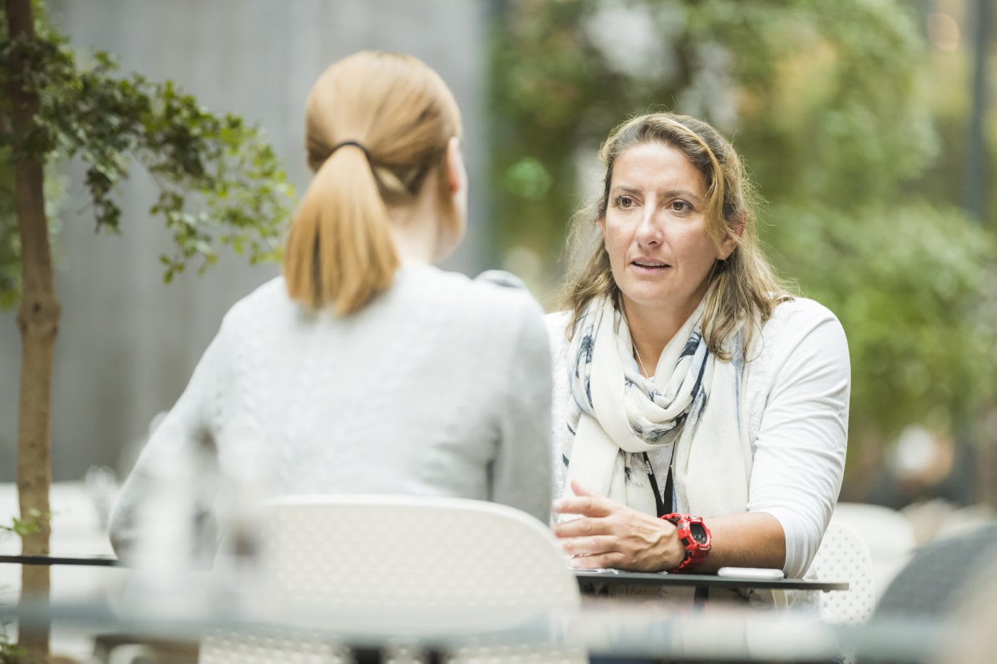 Woman in white shirt sitting down in an interview, talking, Dee Caffari, sailor, yachtswoman, inspirational, positivity, confidence, GamePlan A