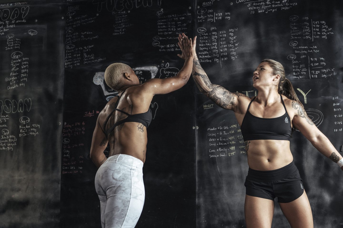 Girls high-fiving each other after doing a sports workout, achievement, success, motivation, emotional strength, passion, Reebok, CrossFit, athlete, sports marketing, GamePlan A