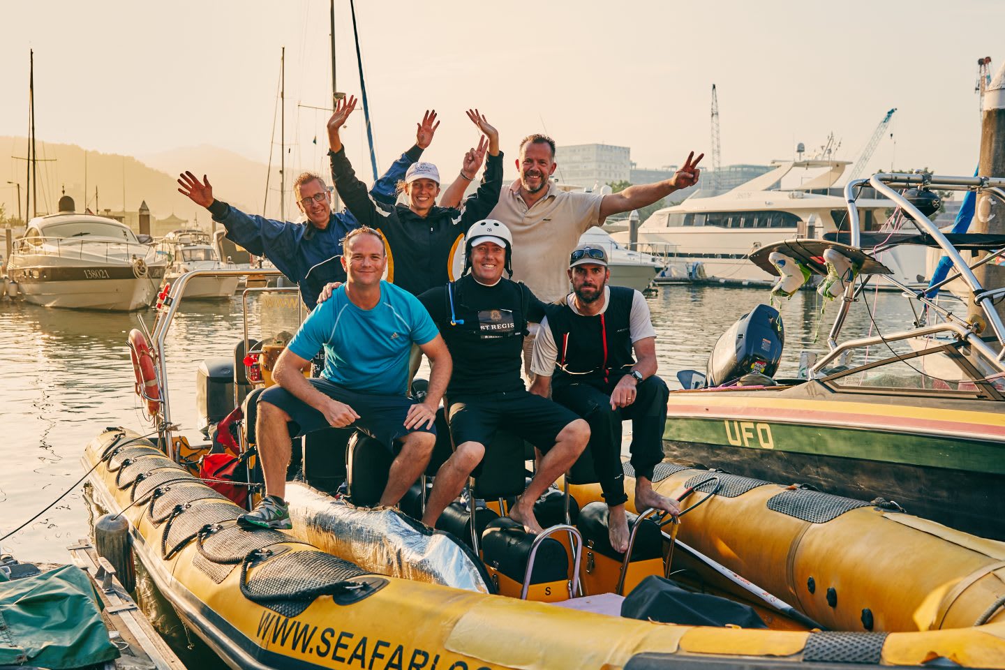 A team of sailors on a boat at the port. They smile into the camera. Nick Moloney, team, teamwork, sailing, career, success, preparation, motivation, mindset, GamePlan A