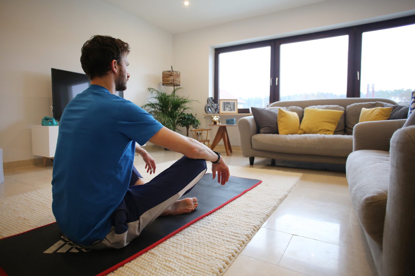 A guy meditating on his yoga mat at home. relaxing, mind training, sleep, meditation, GamePlan A