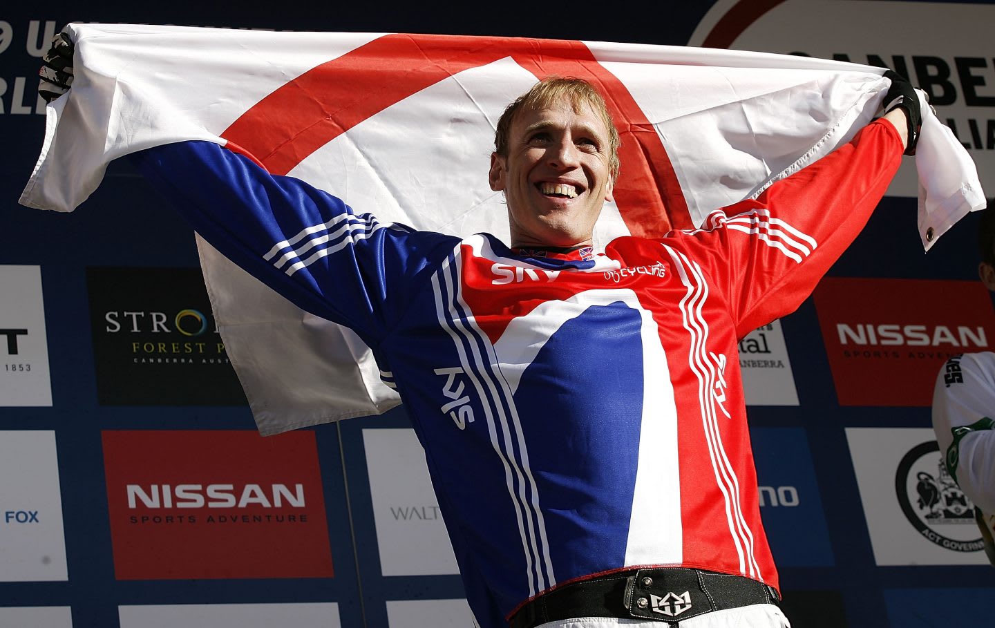 Steve Peat holding English flag in victory