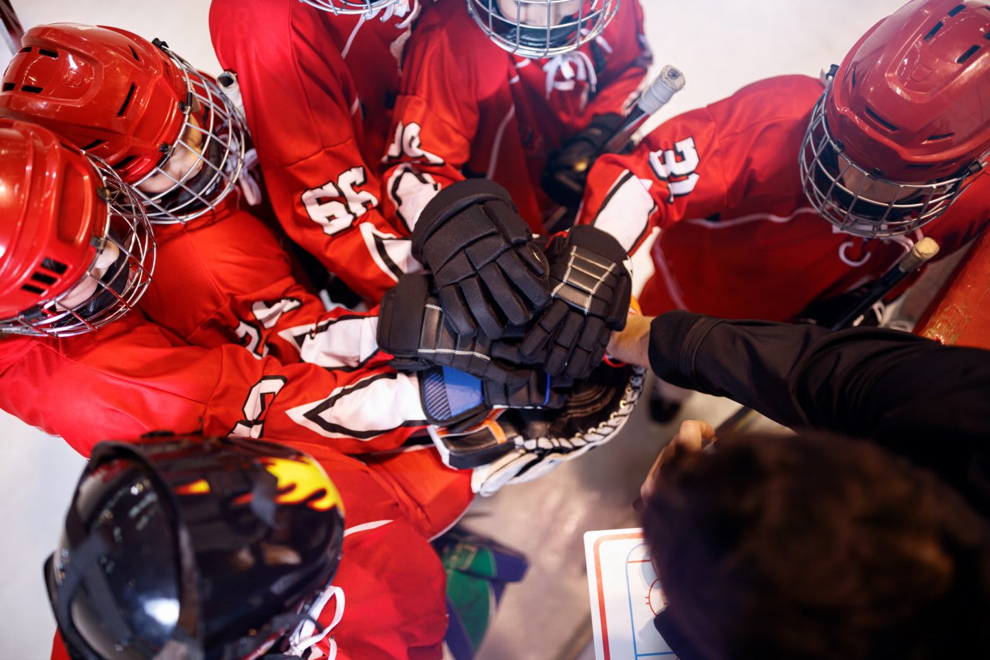Hockey team huddle. | Coaching