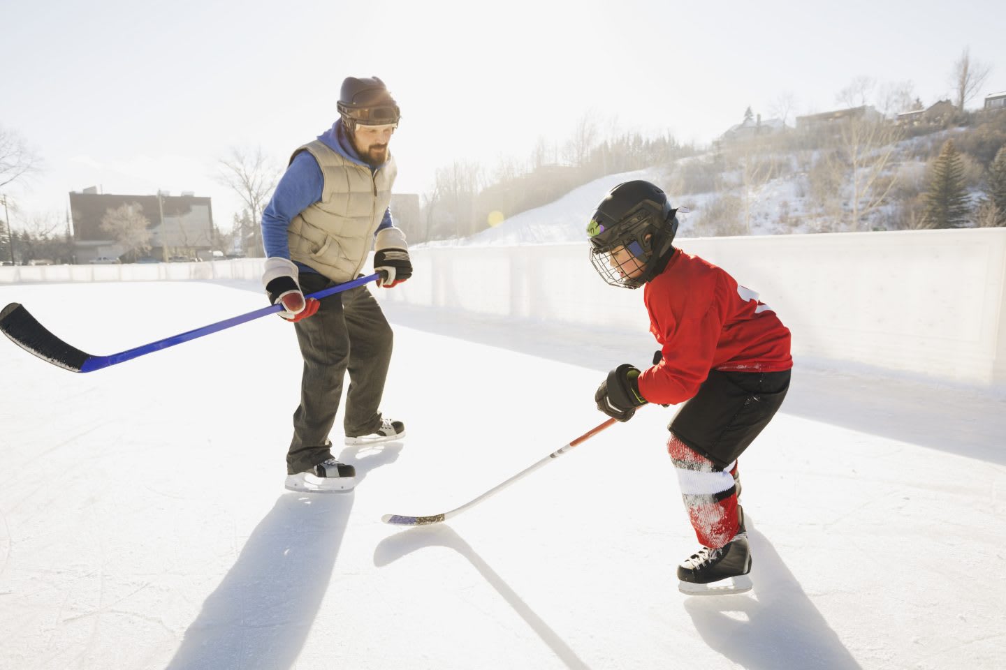 Coach training ice hockey player on rink | Coaching