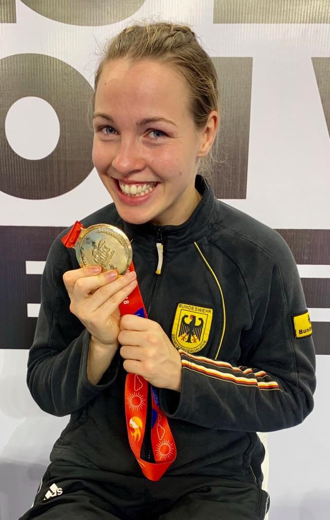 German femal boxer Ornella Wahner smiles broadly as she clutches her World Championship Gold Medal. Gamplan A.