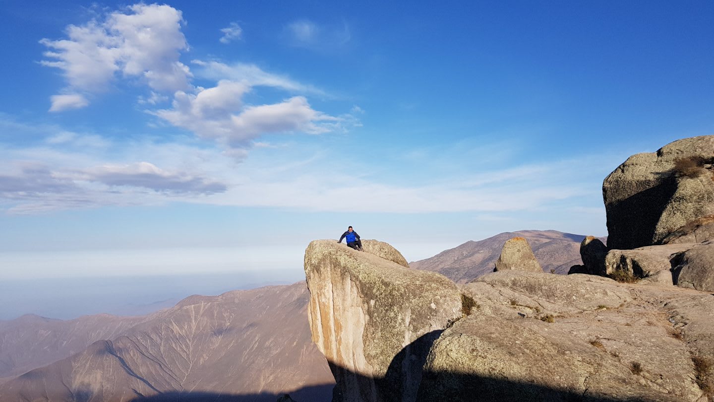 A man climbing in the rocks. disconnect on vacation, holiday, unplug, work, detox, work-life balance