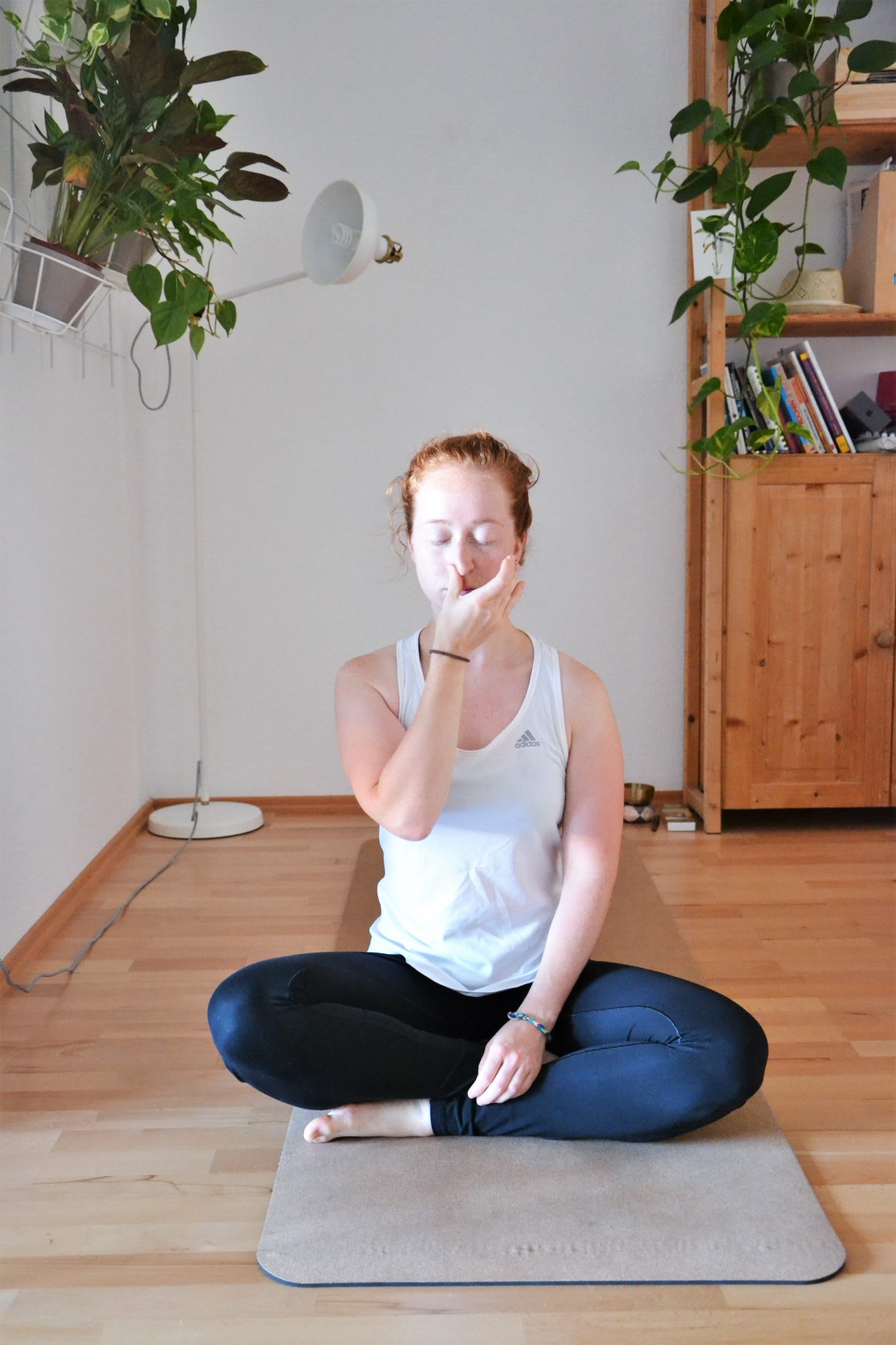 Woman practicing alternate nostril breathing. Breathing techniques, focus, summer, GameplanA