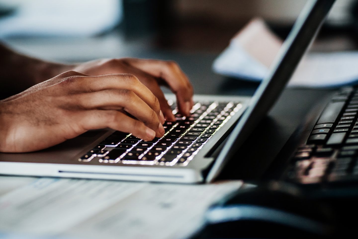 Close Up Of Man Typing On Laptop. student-athlete, studying, sports, social life, balance, mindset