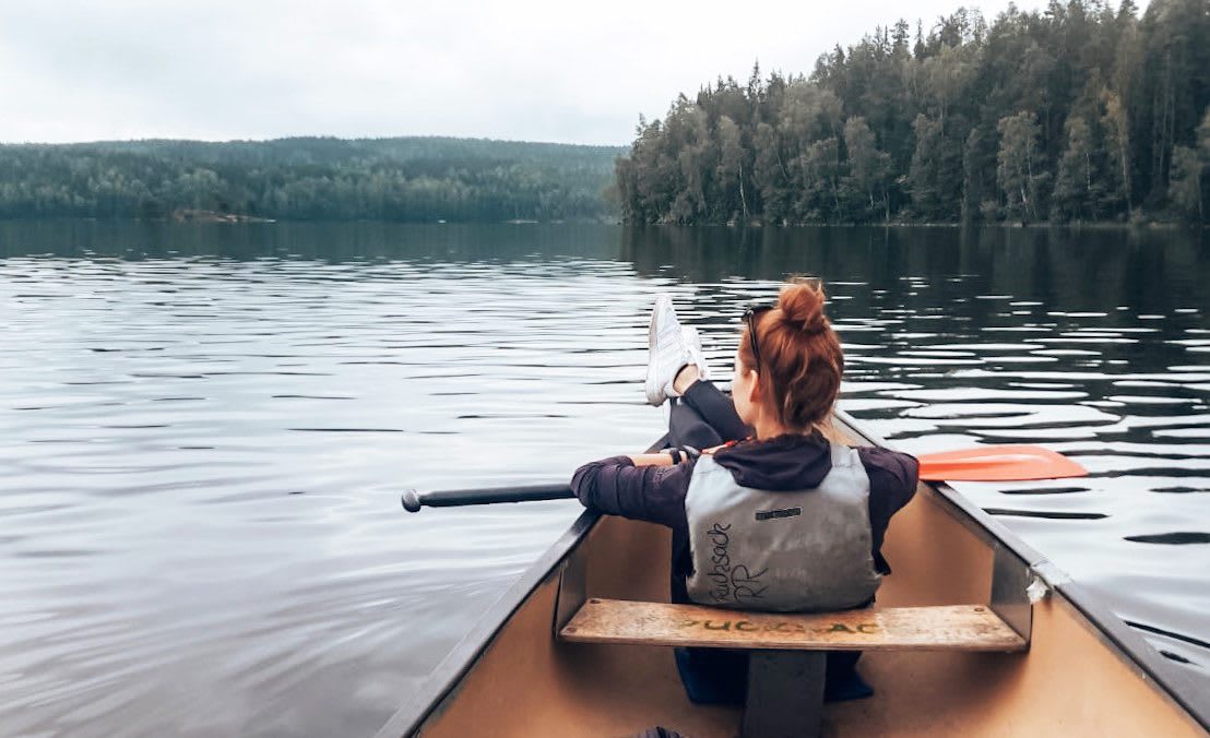 Woman sitting in boat taking in the views.