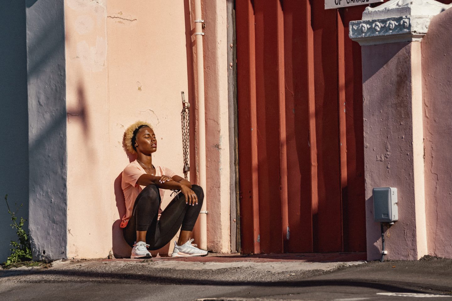 women squatting against wall, Leadership