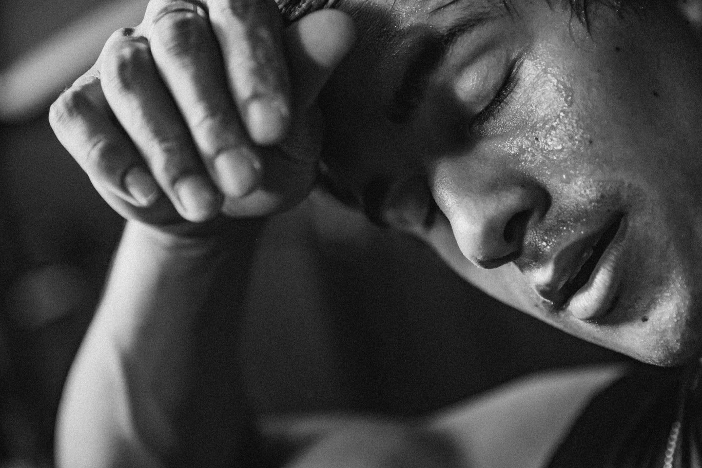 Man swiping sweat off his face with his hand. grit, passion, achieving success, mindfulness, GamePlan A