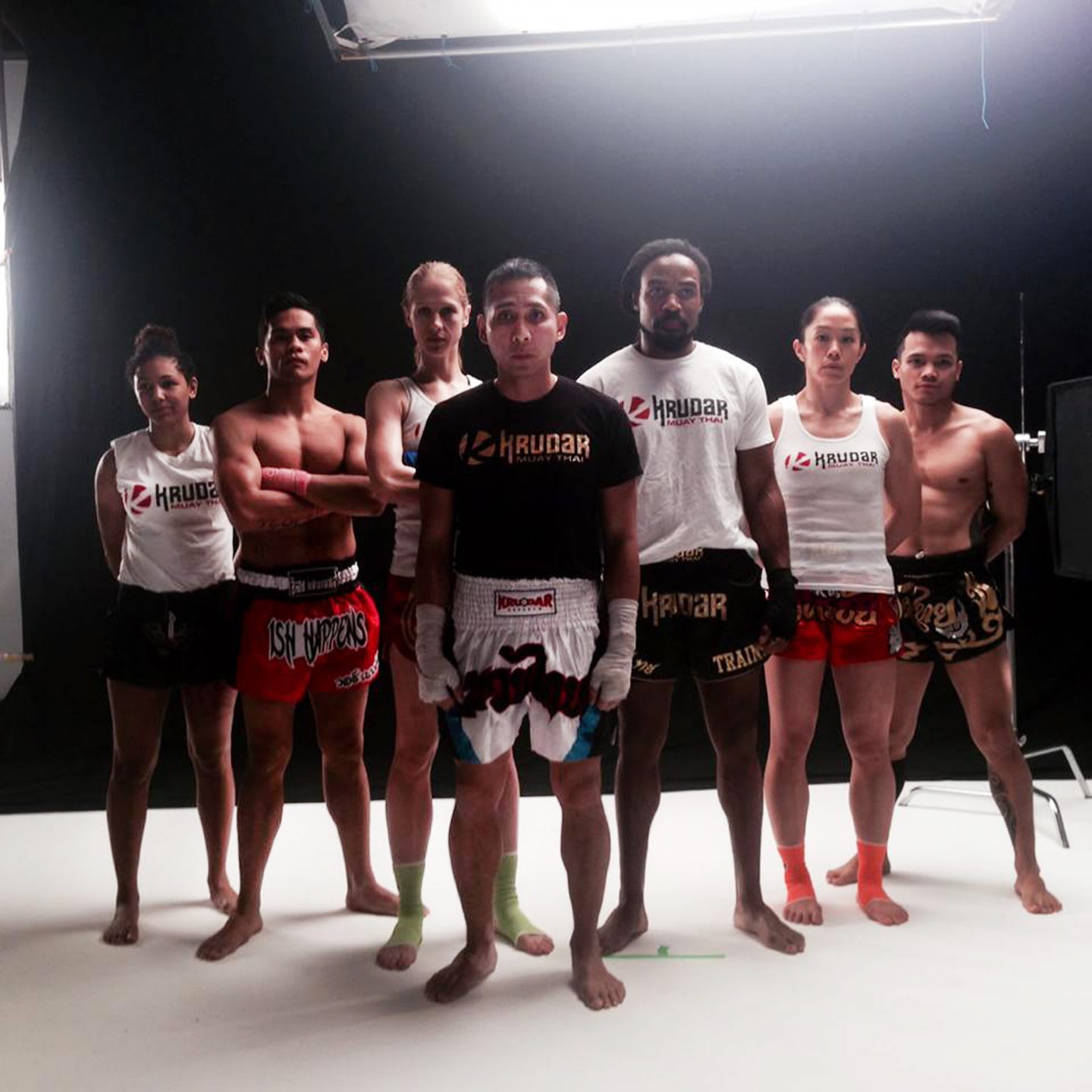 a team of kickboxers posing for a picture
