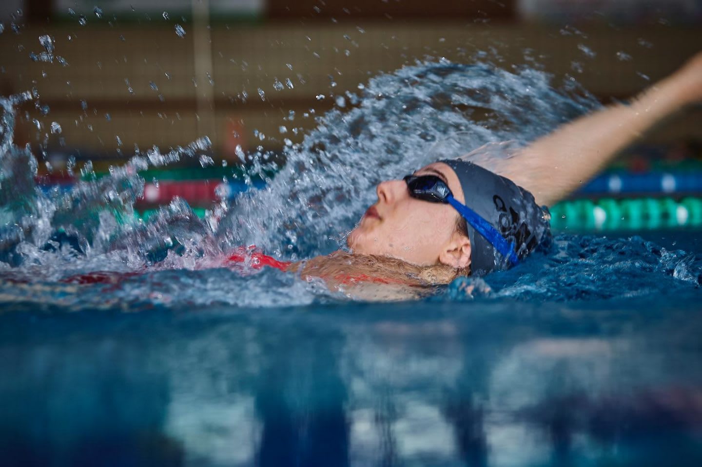 Disabled women swimming backstroke