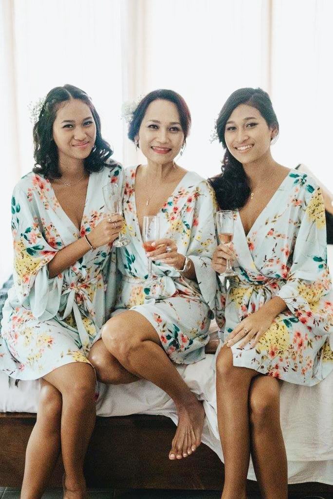 three women in robes sitting next to each other with a glass of champagne, mental health