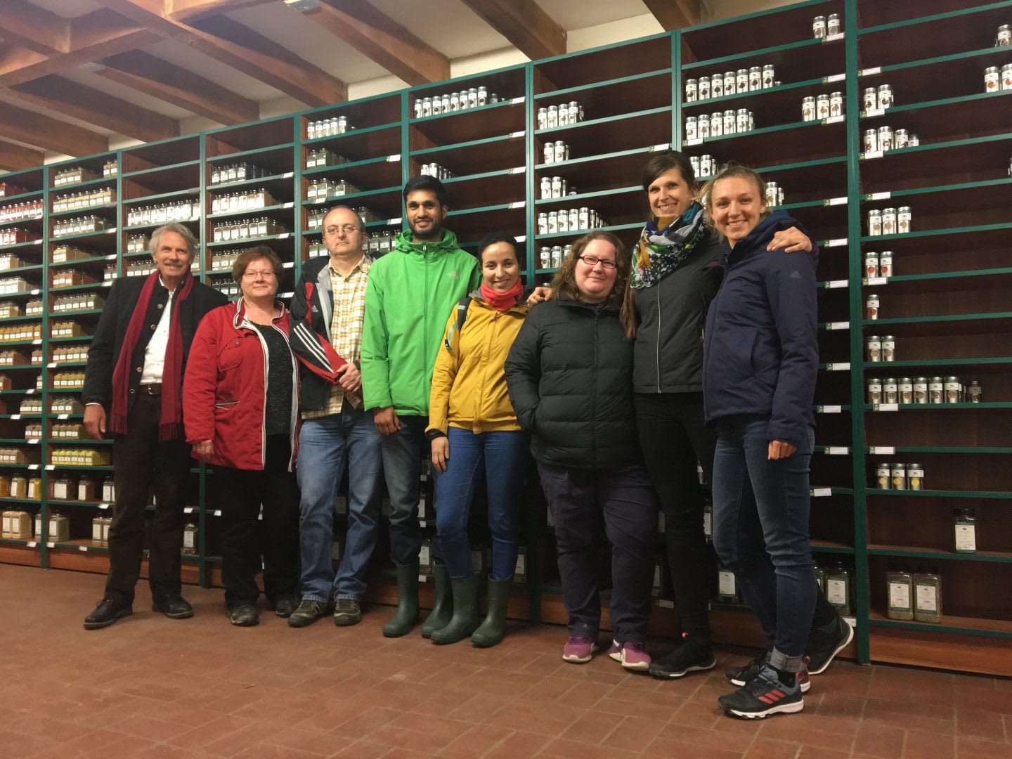 Group posing in front of sustainable BESH products