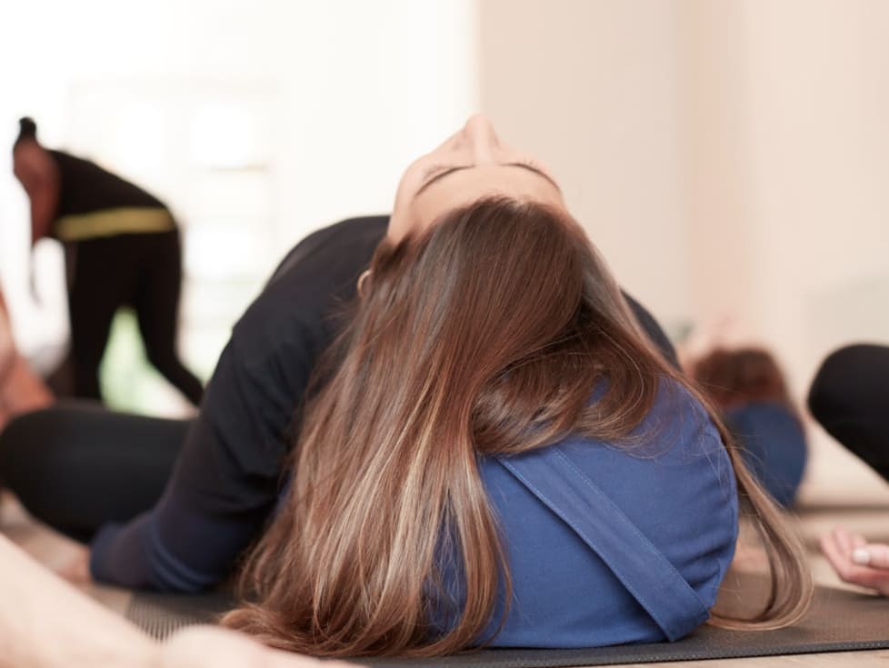 Woman relaxing in yoga supply studio. GamePlanA, Business with purpose