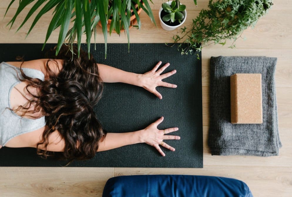 Woman doing a Yoga posture. GamePlanA, BusinessWithPurpose