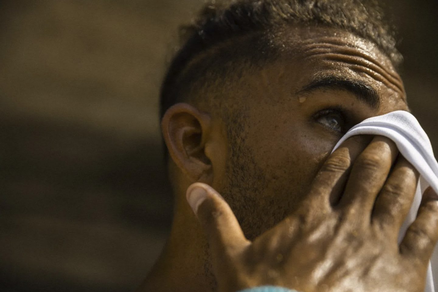 Young men trains outdoors and cleans up his sweat. Feel like giving up, mindset, training, GamePlanA