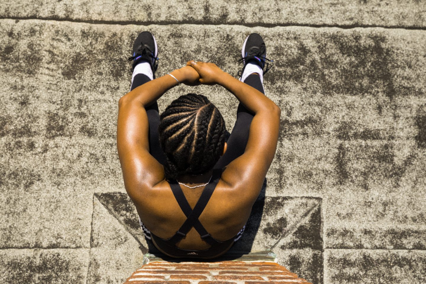 Female training outdoors takes a rest from her routine. Athlete, mindset, adapt to change, GamePlanA