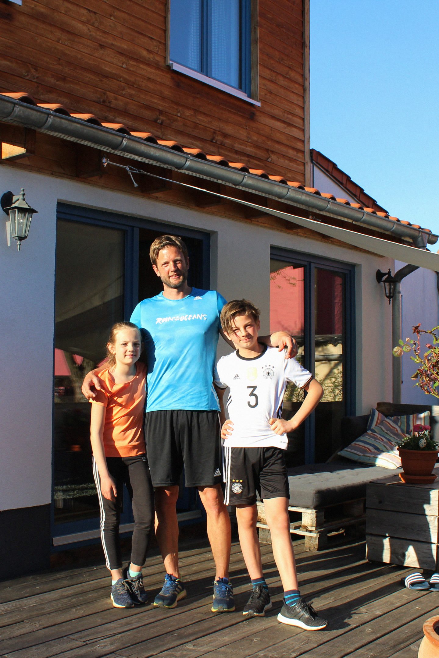 Man at home with children in sports clothes, family, kids, sports, house