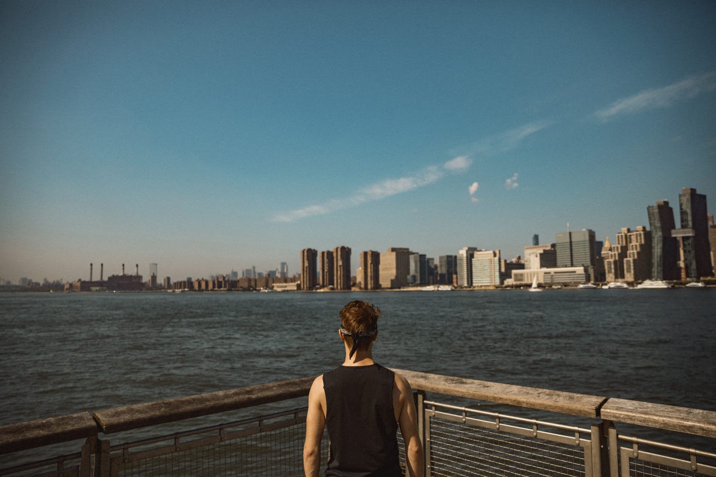 Man in sports clothes looking out at the ocean with skyline in the horizon, view, mindset, mindfulness, thinking