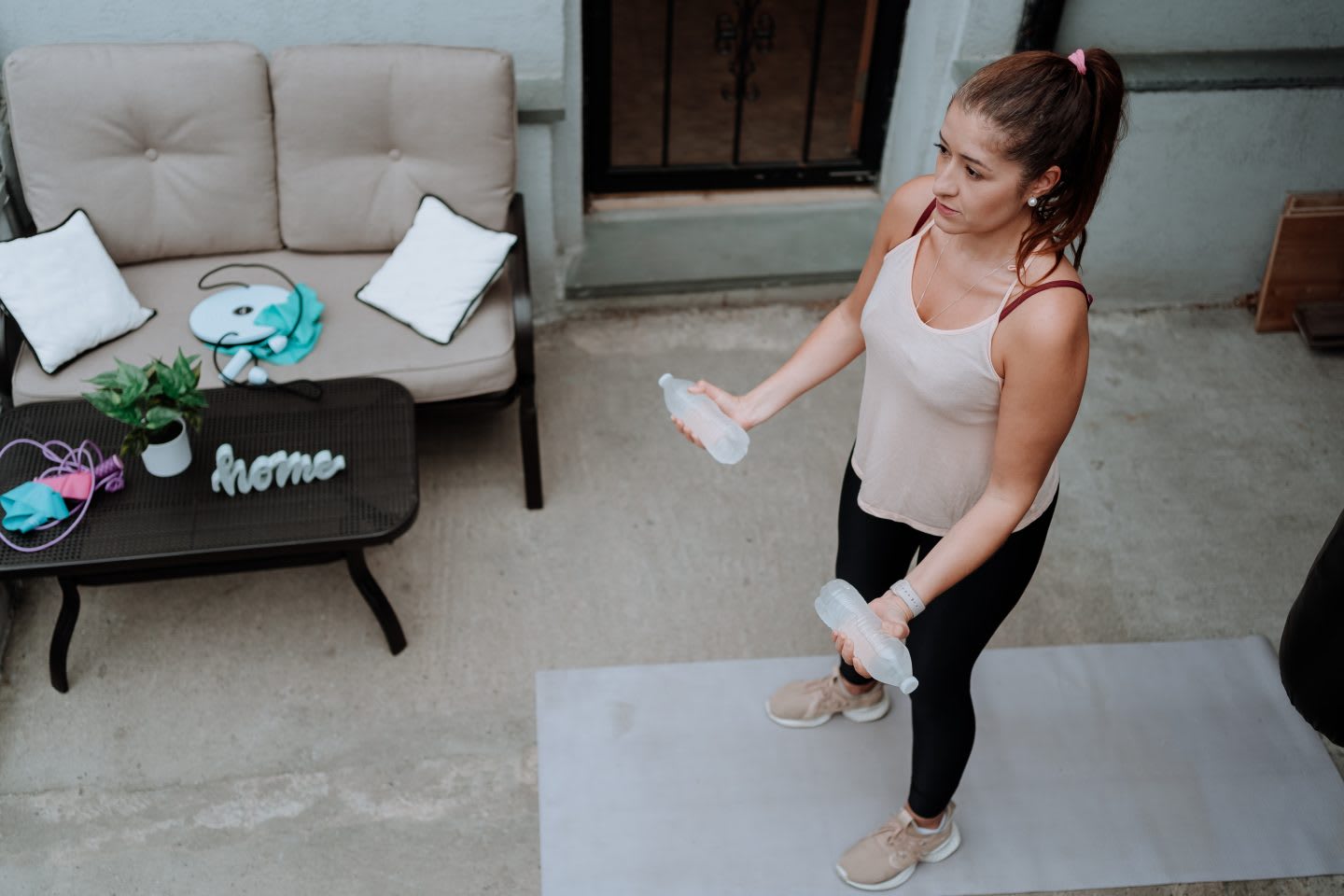 Young woman working out home without traditional equipment, home, exercise, sport, fitness, DIY