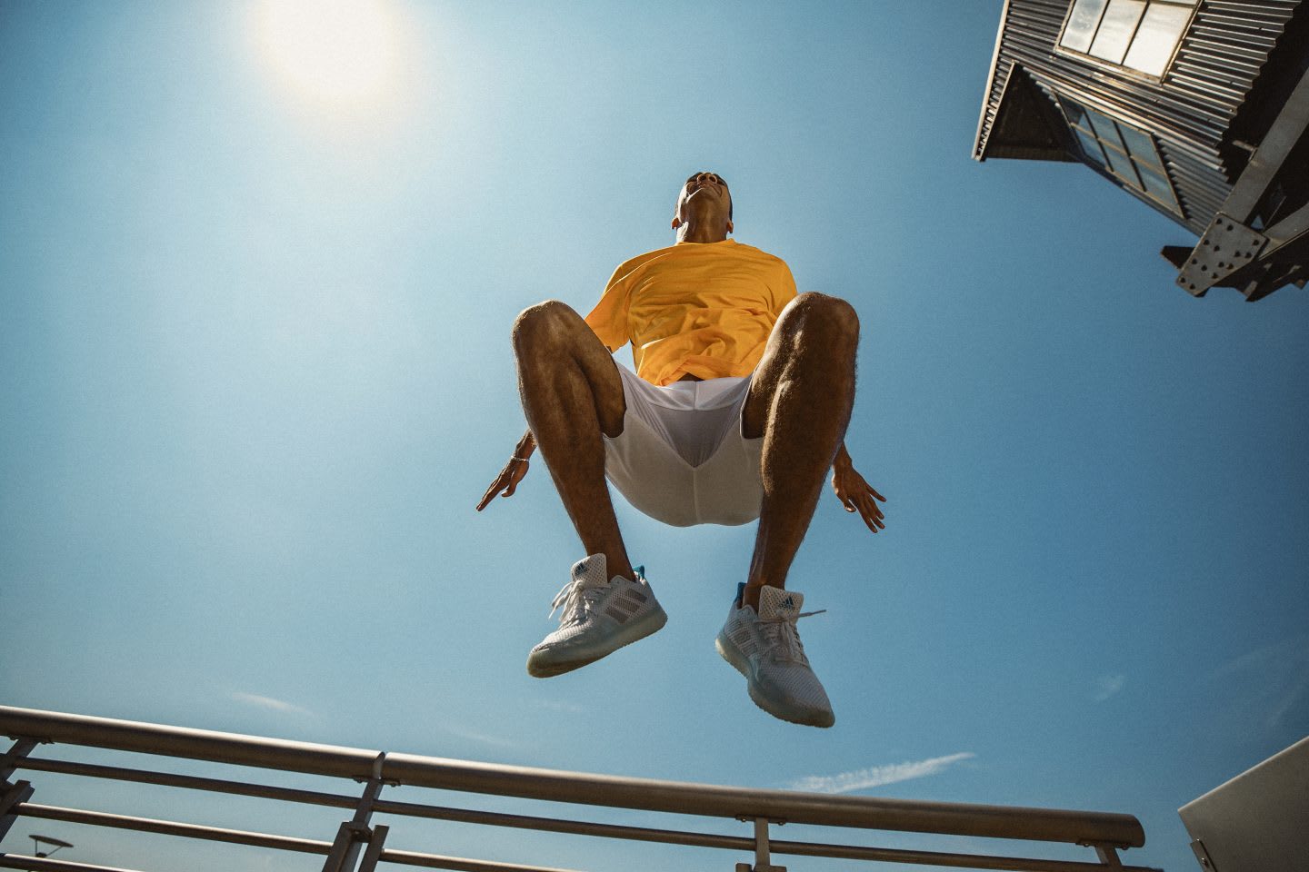 Man in yellow shirt jumping during sport, exercise, fitness, adidas, GamePlan A