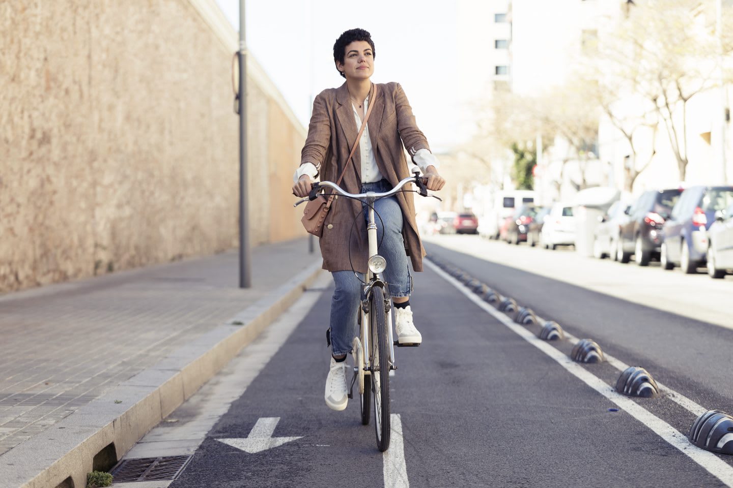 Woman with bike on bicycle lane in the city, commuting, biking, bike, cyclist, cycling