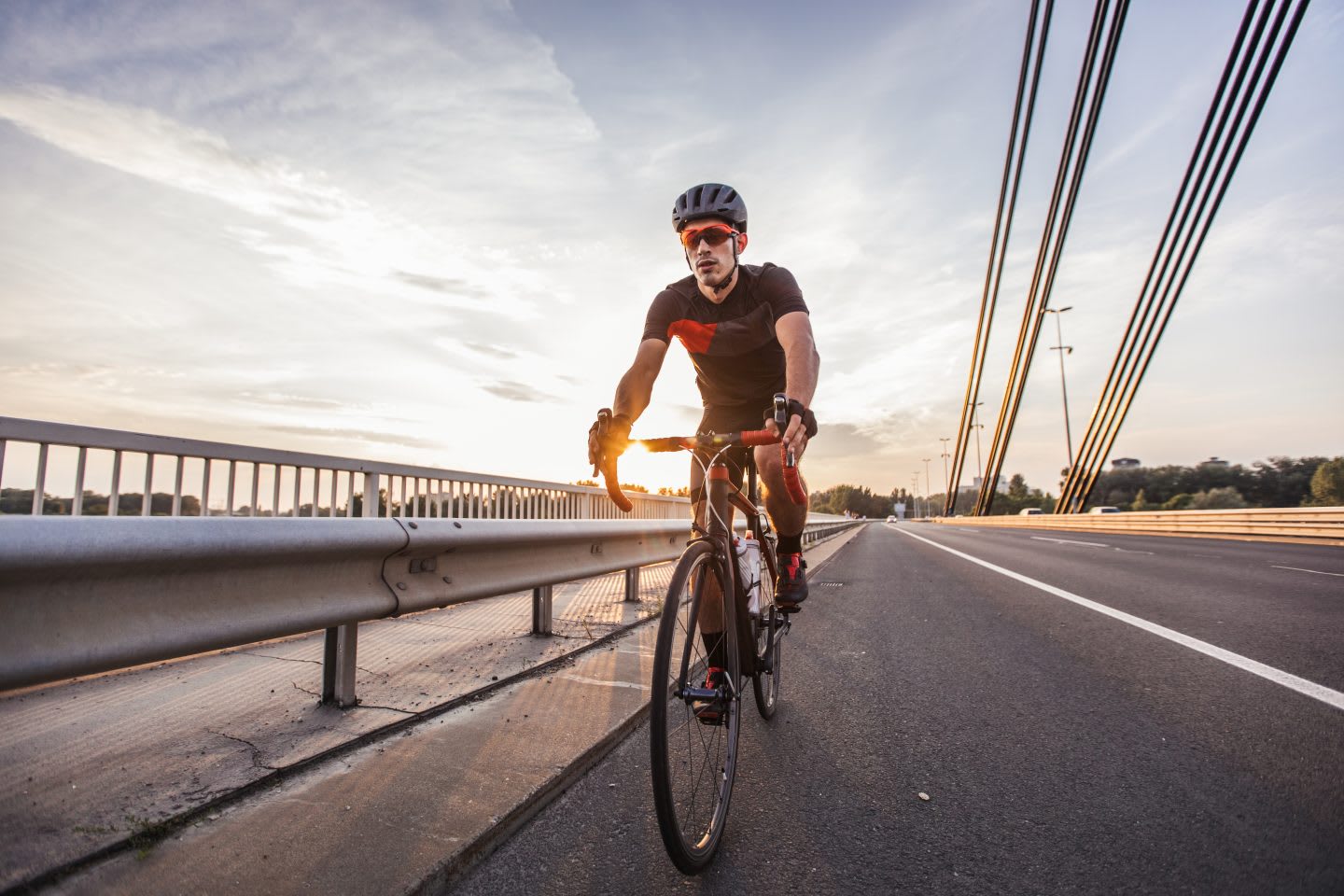 One man, professional cyclist riding his bicycle on the road alone, cyclist, cycling, biker, bike, sport, fitness, exercise