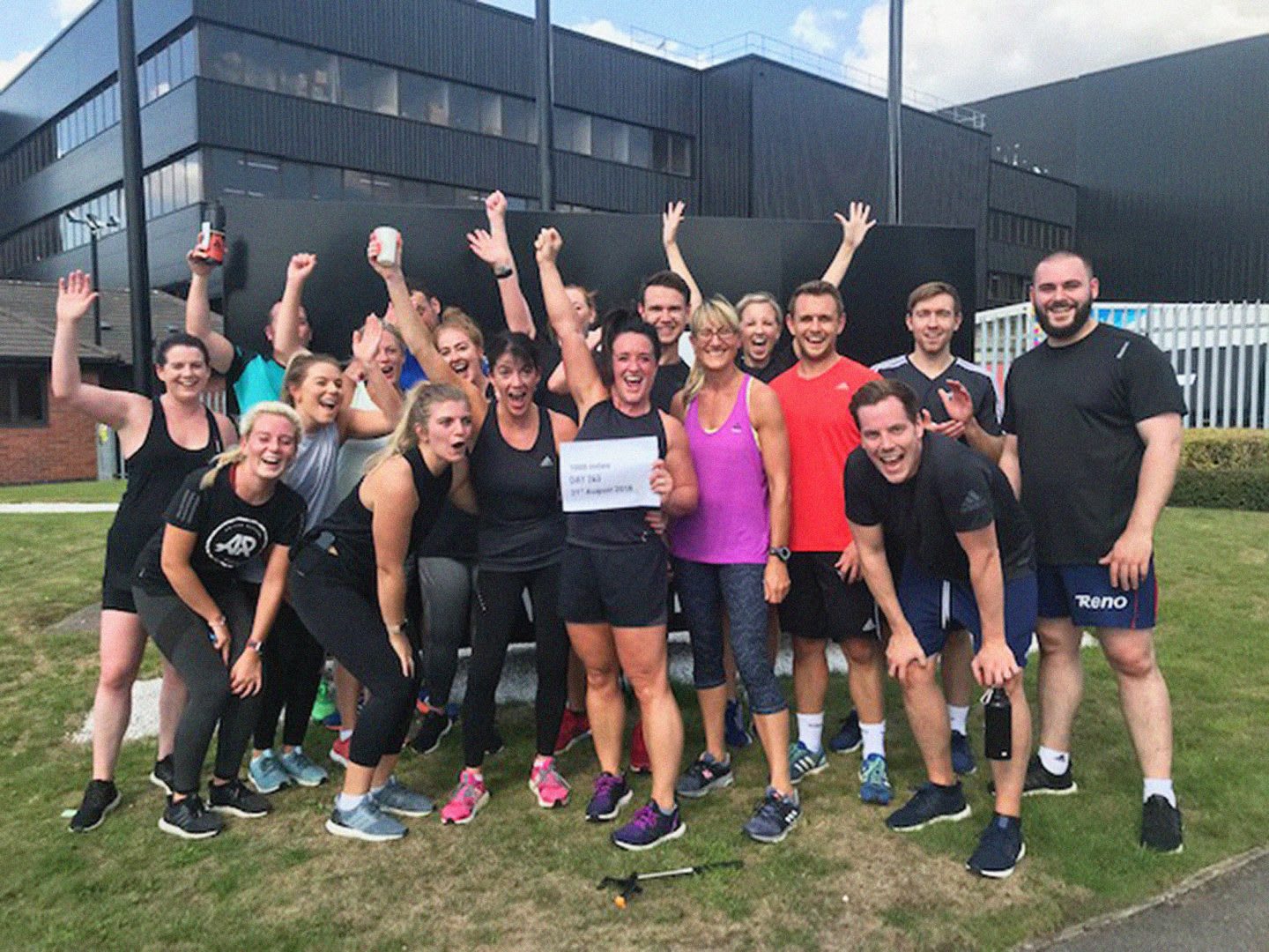 A group of men and woman posing for camera in sports gear after completing group run, Sarah Sanderson, 1000, miles, running, achievement, team, fitness, sport