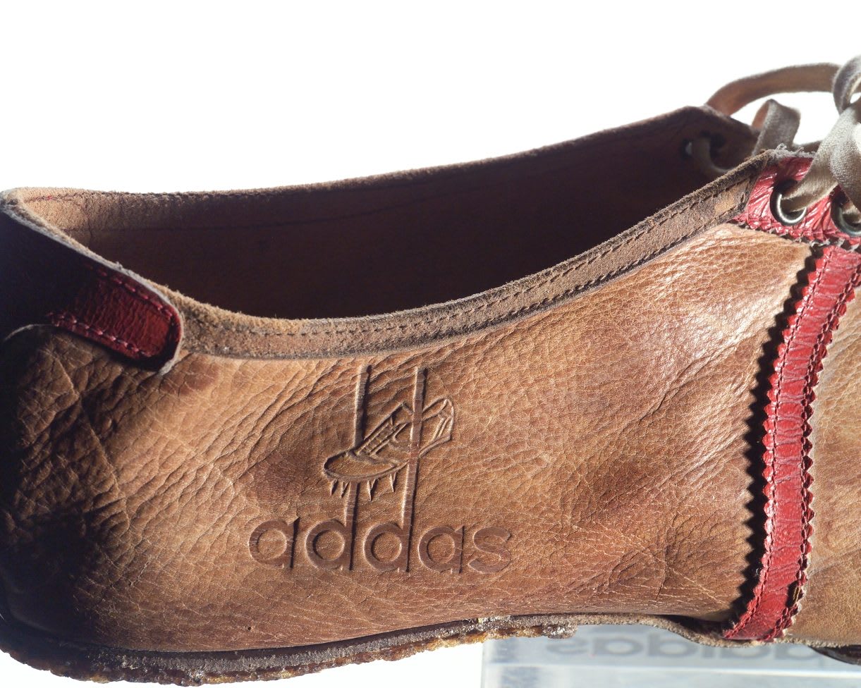 Old fashioned leather running spikes with addas logo embossed on the side, Adolf, Dassler, Adi, adidas, sports, shoes, shoemaker, history, archive