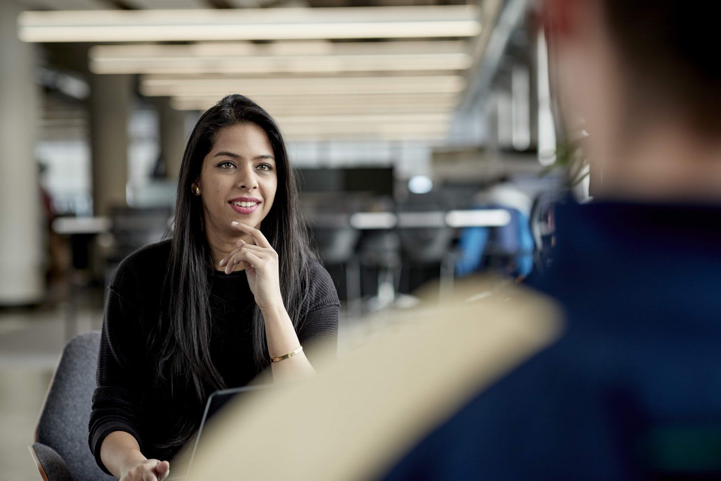 Woman having conversation with man at the office, team, mentoring, mentorship, career, job
