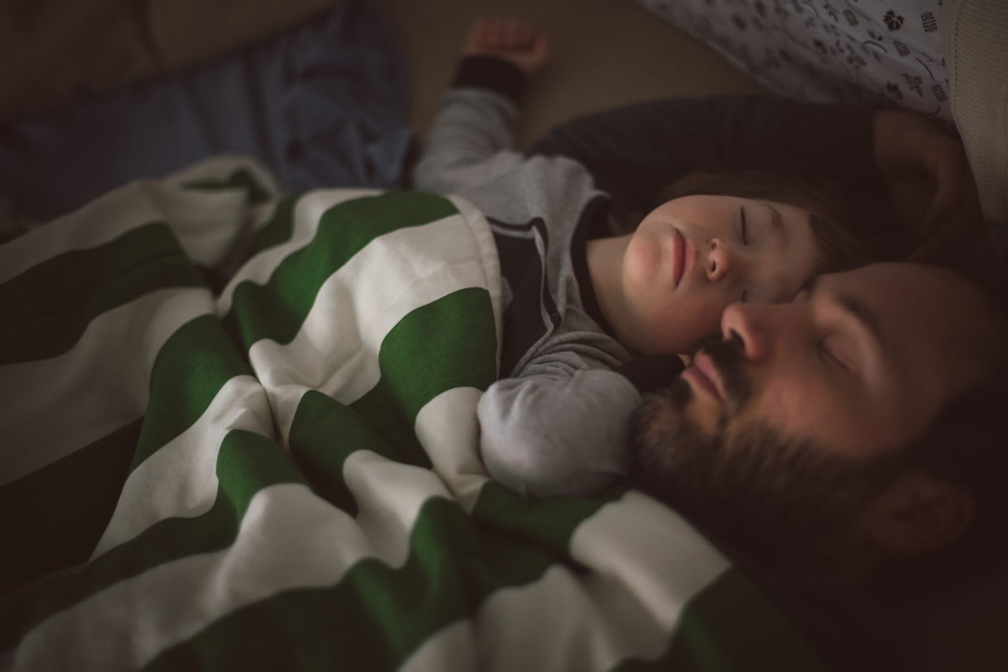 Dad and toddler sleeping together in the sofa, rest, recovery, family, sleep