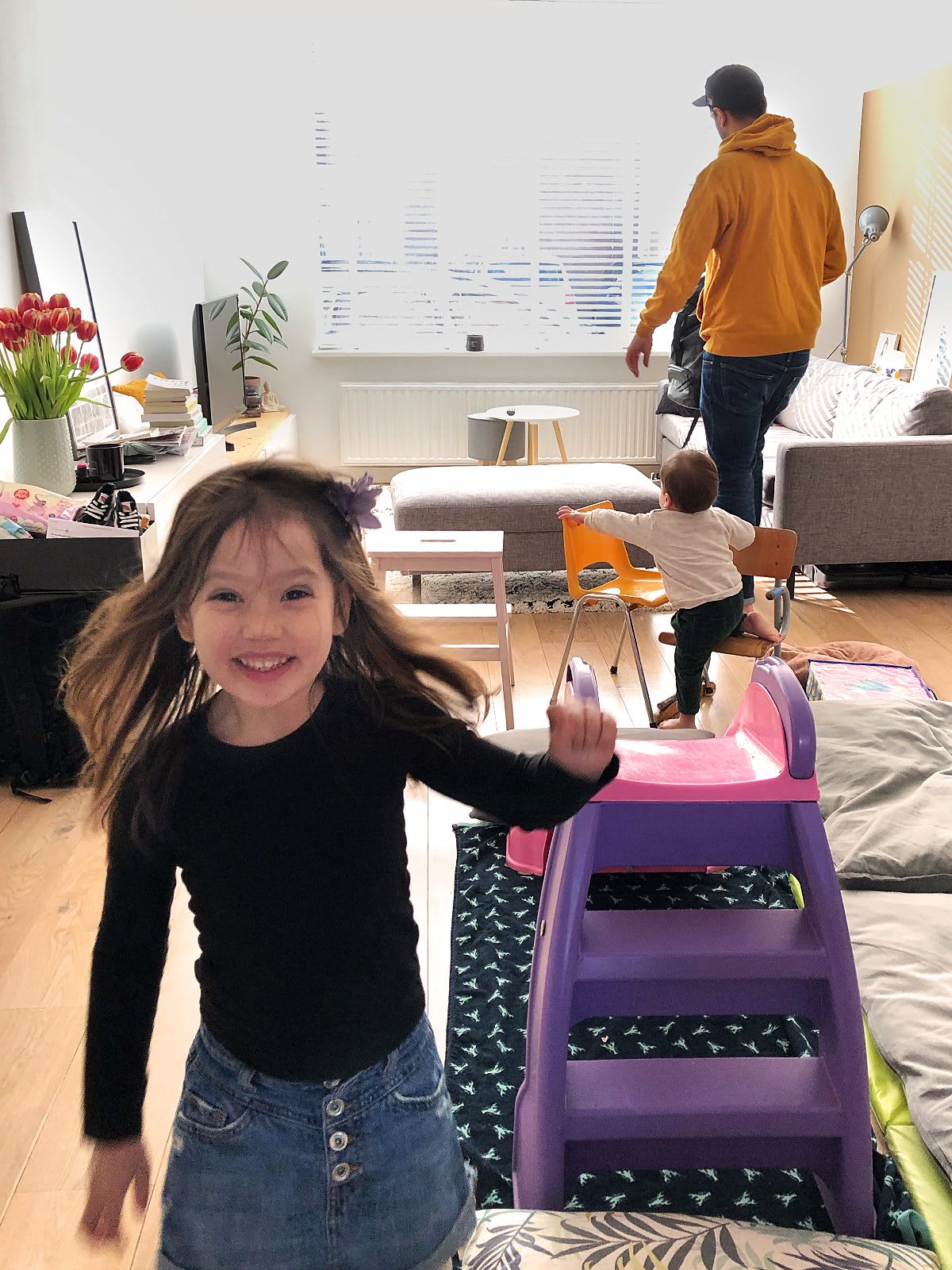 Happy girl running through the living room while playing, family, home, happy
