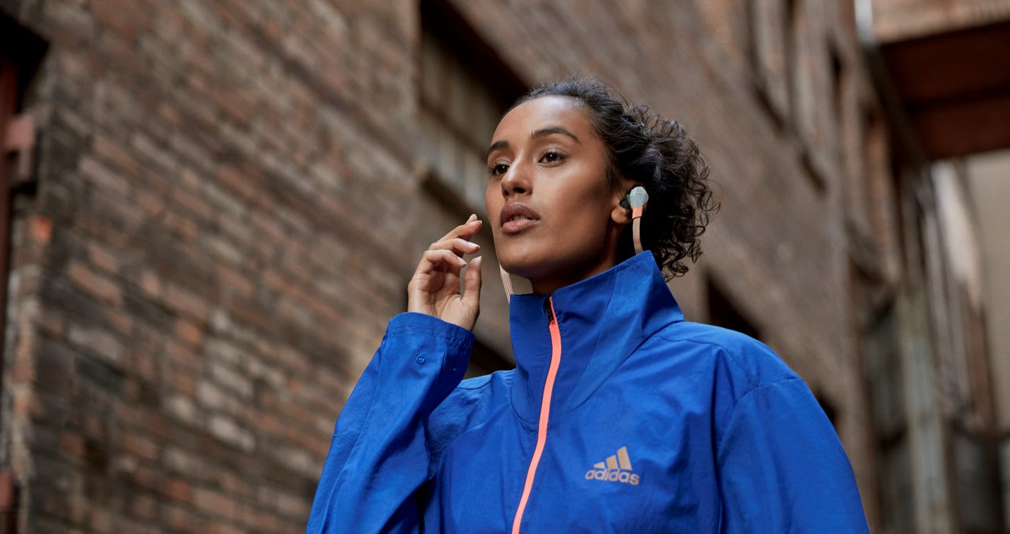 woman listening to a podcast while doing sports. Podcast, listening, learn, race, inclusion