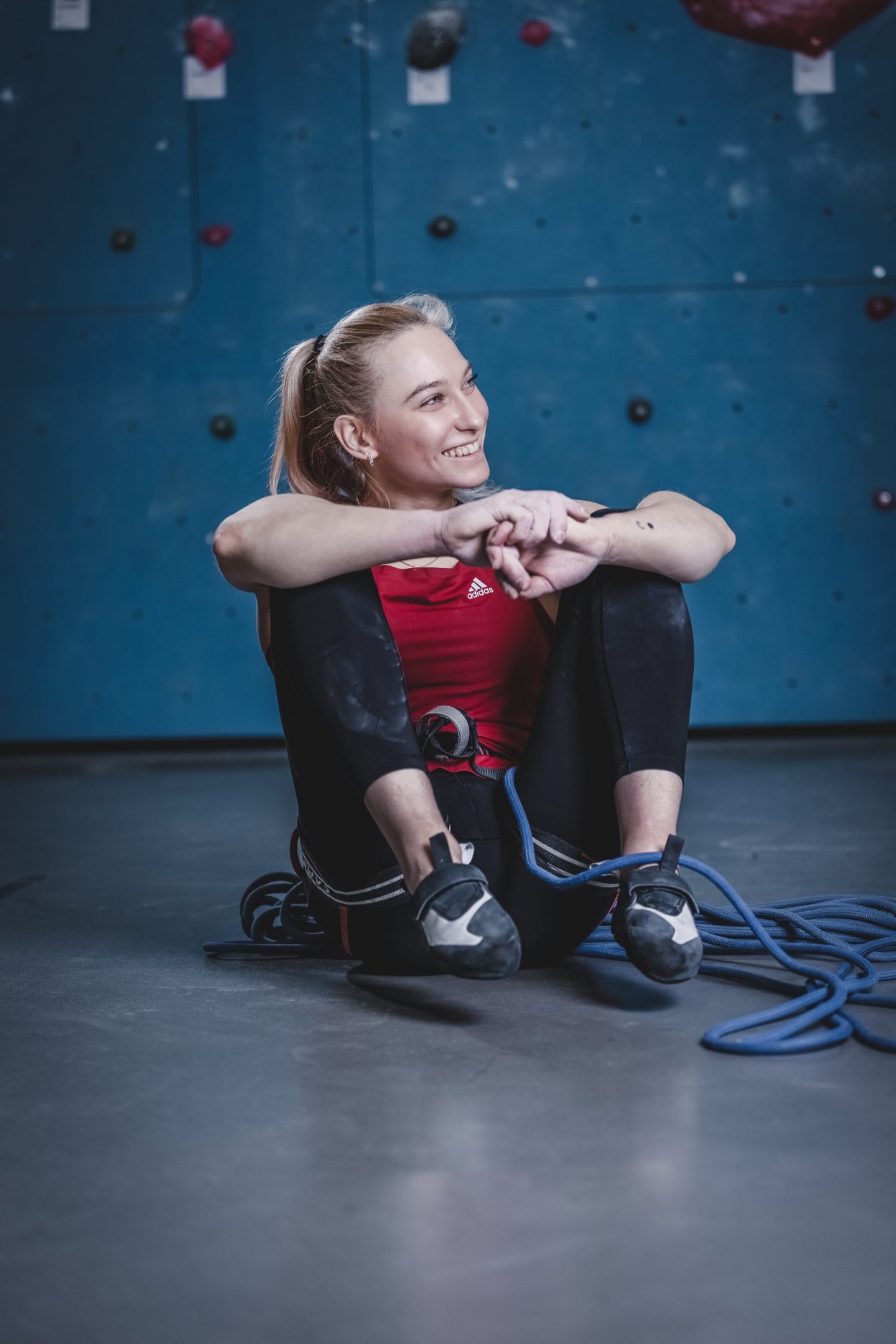 Janja Garnbret sitting and smiling after climbing session. Janja Garnbret, climbing, mindset,