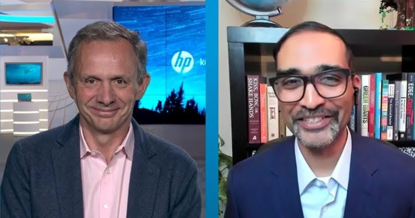 Two men smiling while talking to each other on split screen, Ryan, Patel, Enrique, Lores, HP, business