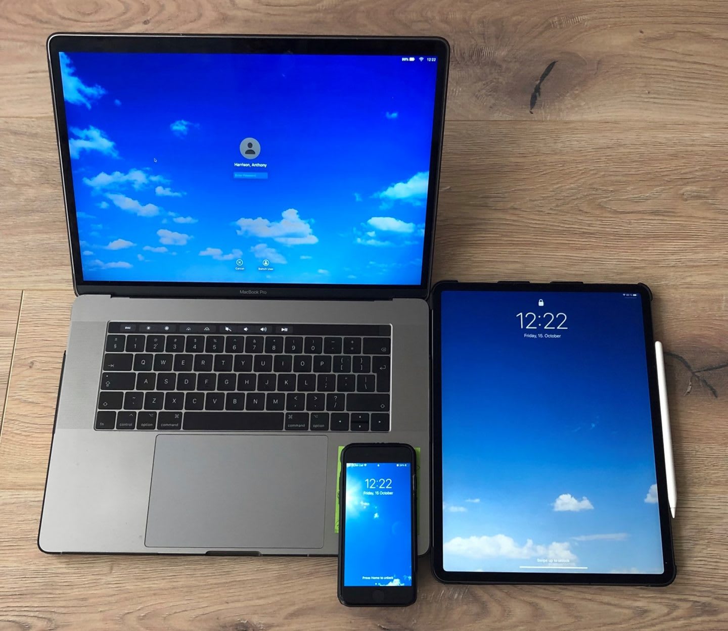 desk with laptop, tablet and phone with the sky as background image, display, clouds