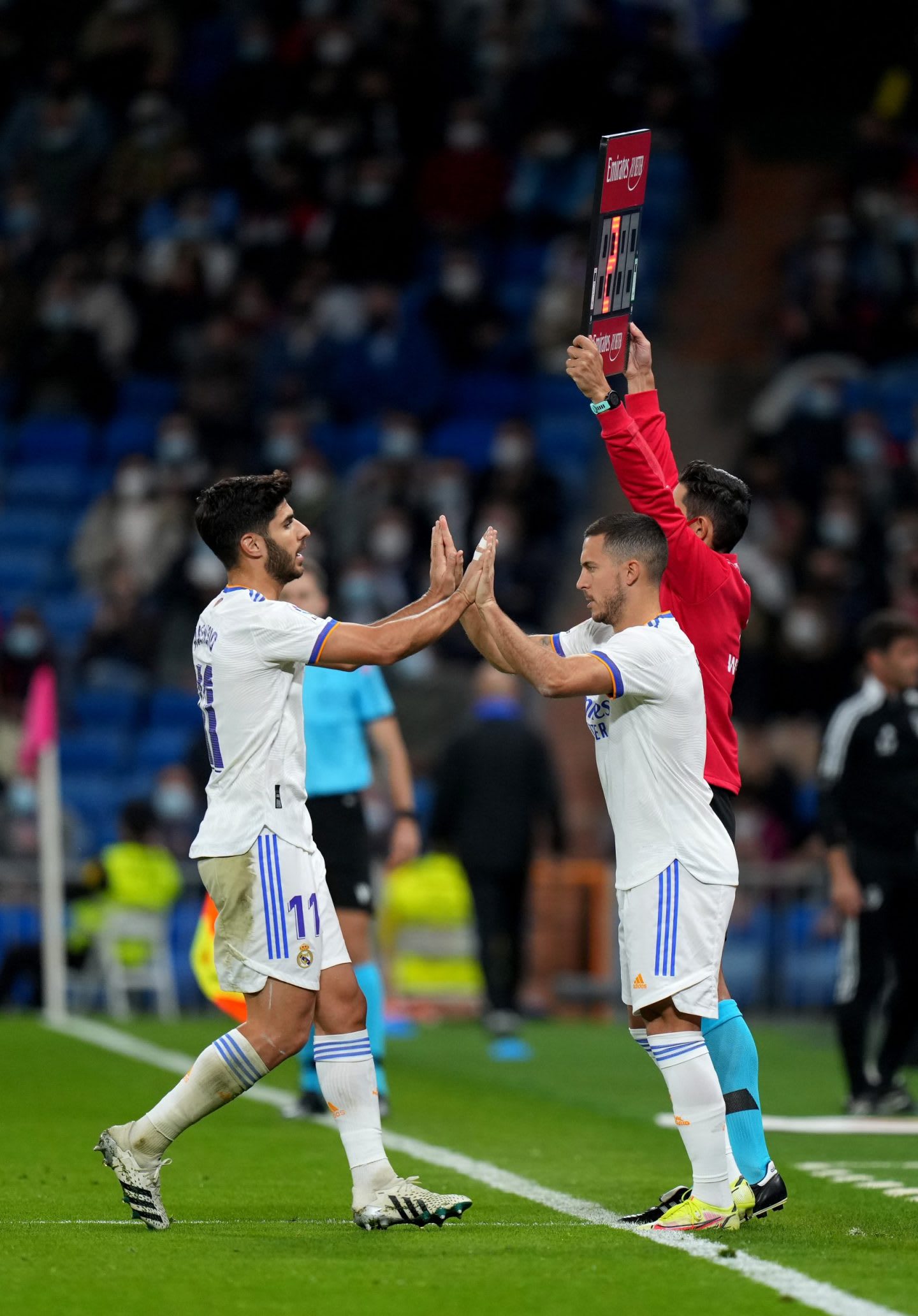 Marco Asensio giving high five in stadium